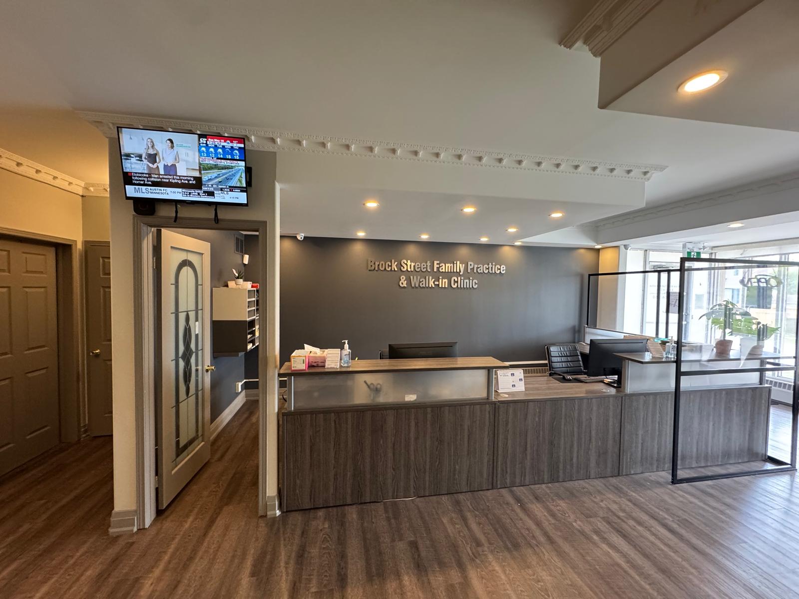 Inside Brock Street Family Practice — the welcoming front reception desk and signage